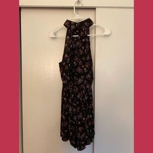 black flowy high neck romper with pink floral